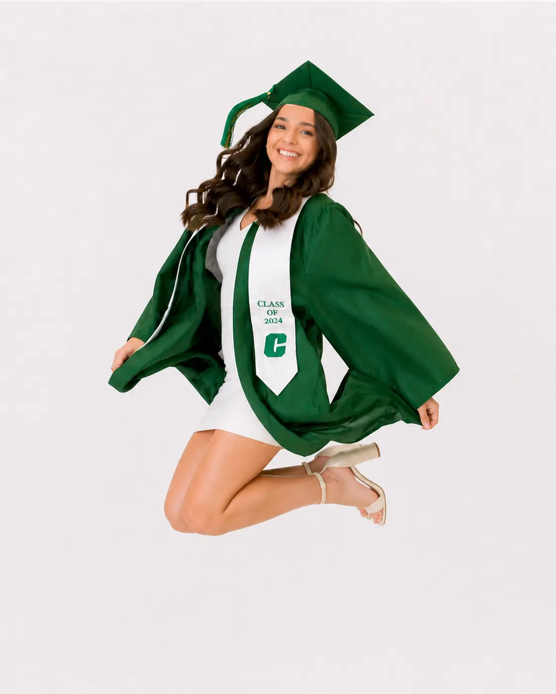 Senior graduate jumping on a white background for a fast Class of 2026 portrait