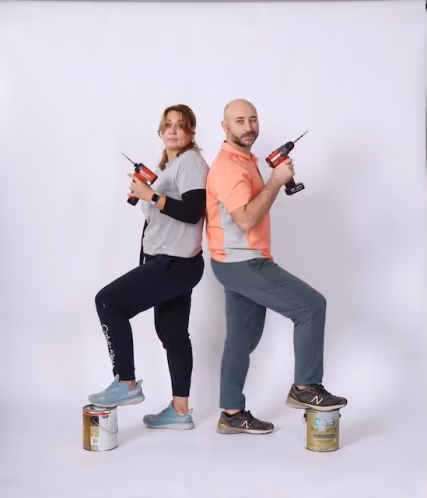 Leonid and Olga joking with drills and paint cans while building HQ Portraits